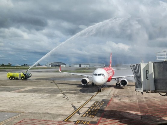 The AK5432 aircraft from Penang gets a water salute welcome upon arrival at the KIA. / Photo from linked article.