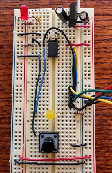 Picture of the actual breadboard with an ATtiny45 wired up with an LED and tact switch. Sorry no Fritzing version! 