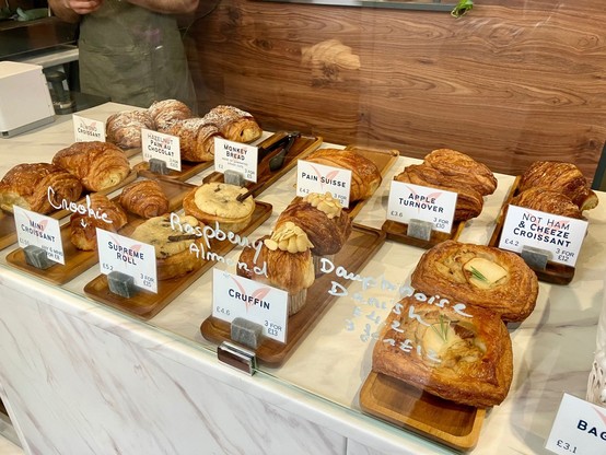 Array of pastries in display cabinet