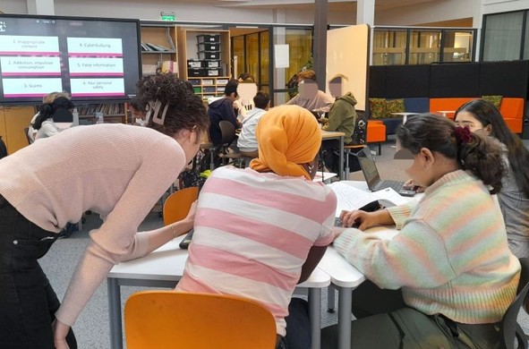 A group of girls working on their Scratch stories