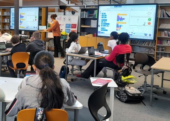 A teaching session on Scratch with school students
