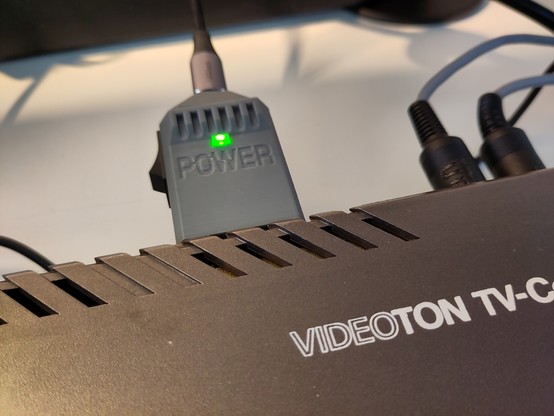 A mini aftermarket USB-C-style Power adapter for Videoton TVC, in a 3D printed case.