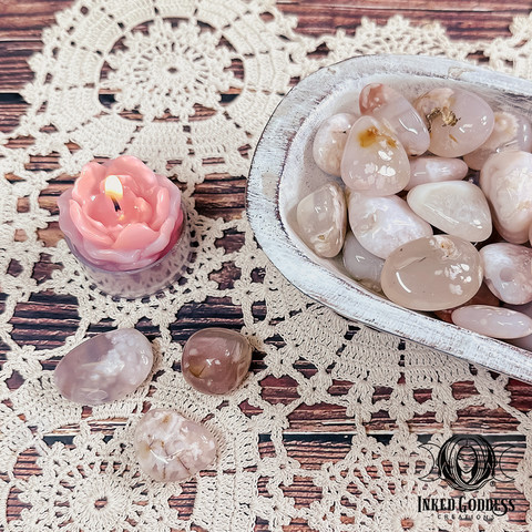 A photo of the Cherry Blossom Agate Tumbled Gemstone from Inked Goddess Creations.