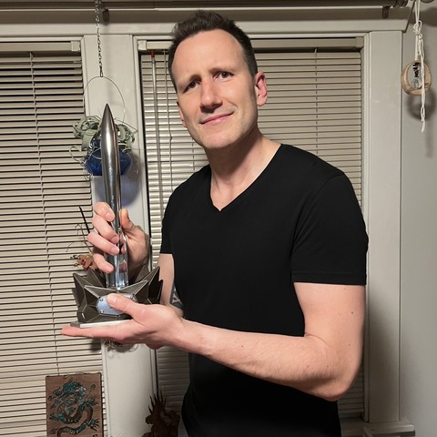 Me with an actual Hugo Award that is actually not mine.