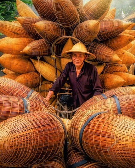 Traditional bamboo fish trap salesman in Vietnam