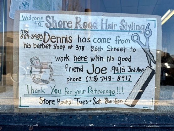 A meticulously handmade sign about two barbers who are joining up in the same shop