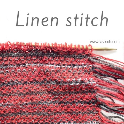 A knitting needle with a project in linen stitch on it, in the colors gray, red, variegated black & gray's. The project is edged with fringe.