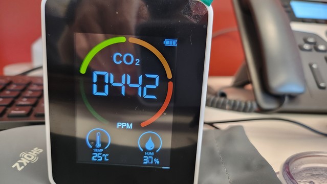 A CO2 detector showing the ambient temp 25 degrees C (77f)