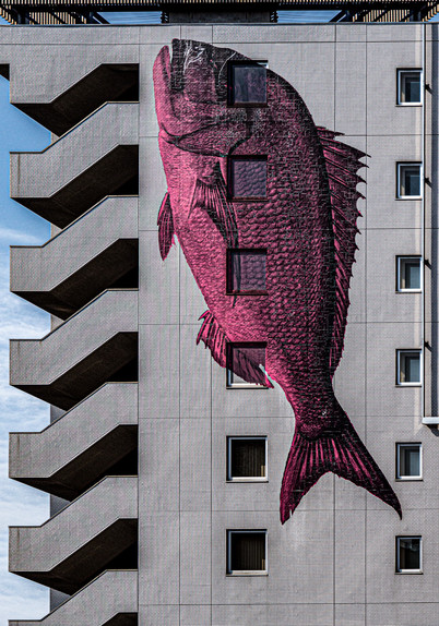 Fish mural on the side of a building in Japan.