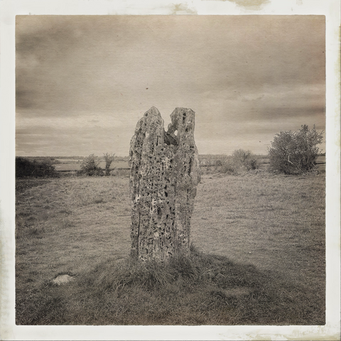 The Hawk Stone: a single standing stone in a field in The Cotswolds