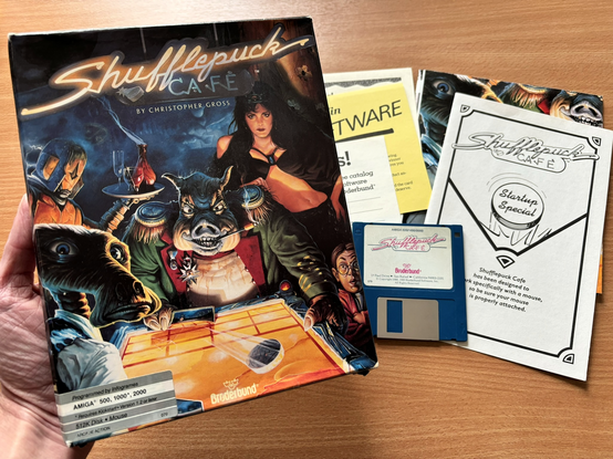 The Shufflepuck Cafe box (Amiga version) and its contents.