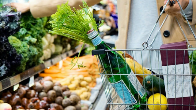 A woman is seen shopping for groceries in this image. Photo: Unsplash. 