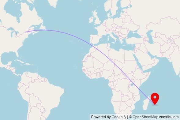 A map showing the great circle route from Montreal in Canada to a map pin at Mosquée Kouba, Rue de Saint-Paul, 97420 Le Port, France