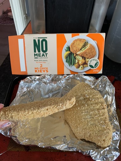 Iceland no meat company box for no chick kieves and 2 very flat faux chicken pieces on a baking tray