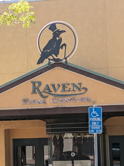 The Raven cinema comes with the logo and image of a top-hatted raven sitting up proudly and leaning on his cane.