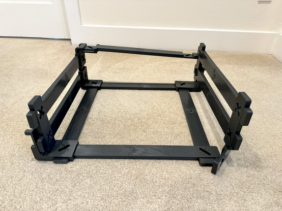 A rectangular cage of 3D printed bars and corner pieces that lock together