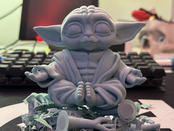 Grogu from starwars in a meditating pose