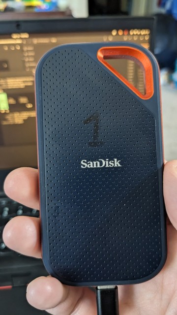 A rugged external SanDisk drive that appears to be dead from testing on two computers.