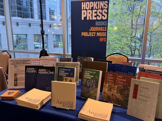 A detail of the Hopkins Press booth at #AAAS2024, tightly focused on the journals