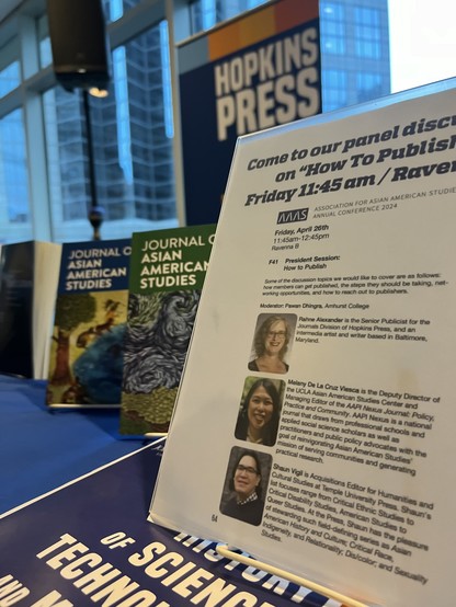 A closeup of the event flyer for the How To Publish panel at #AAAs2024 with the Hopkins Press logo and issues of Journal of Asian American Studies in the background 