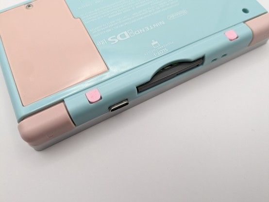 A gameboy macro face down showing the USB C charging/tv out port 