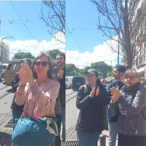 Pessoas a aplaudir a marcha lenta