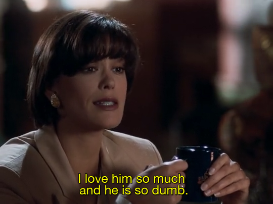 Still from Lois & Clark season 3. A close-up on Teri Hatcher (Lois) holding a mug. The subtitle reads "I love him so much and he is so dumb"