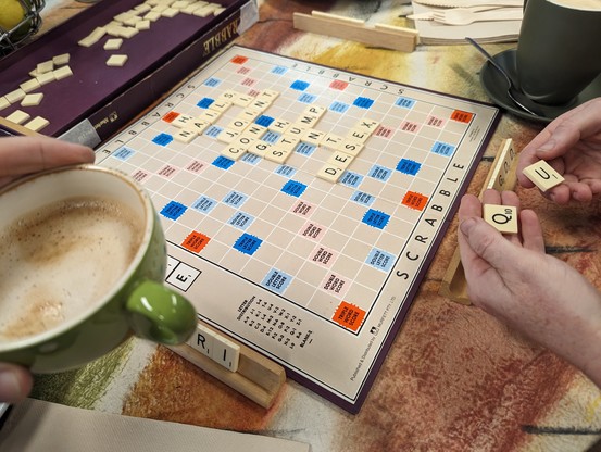 Scrabble game underway. 
Played two tiles, drew Q+U.