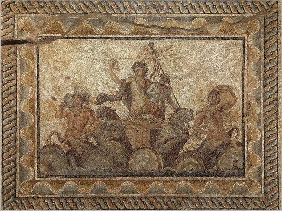 Mosaic of Dionysos holding his thyrsos and a drinking horn as he stands in a chariot pulled over the waves by centaurs and lynxes. His foster father, the old satyr Silenos, is standing beside him.