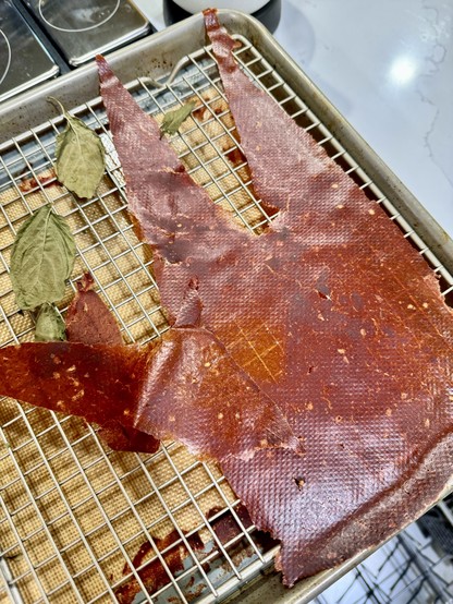 Dehydrated tomato sauce on a sheet pan