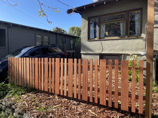 Redwood fence in front of a house