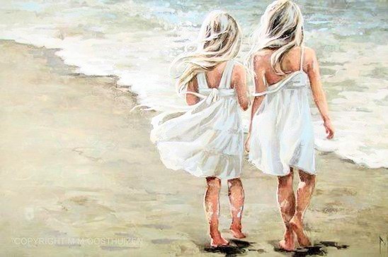 Two little girls in white sundresses walking barefoot on beach 