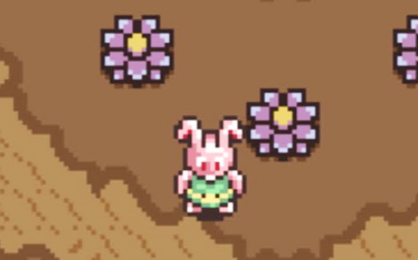 A picture of Link from Legend of Zelda transformed as a pink rabbit. He's surrounded by some weird purple bushes in the Dark World.