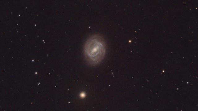 This is a crop of the previous image, but only showing the M58 galaxy. At this scale, low level noise is noticeable throughout the image.