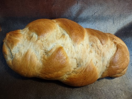 Photo: Daughter's vegan challah -- a braided bread -- glazed with maple syrup, just out of the oven. Yum!