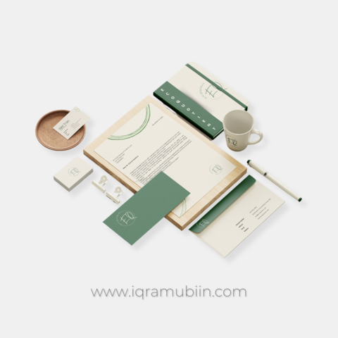 An image mockup of Eco Quotient's new line of eco-friendly stationery. The stationery is displayed on a wooden table and features a green and beige  color scheme with earthy tones. The mockup also includes a beige mug with greene text that reads "eco quotient" 
www.iqramubiin.com