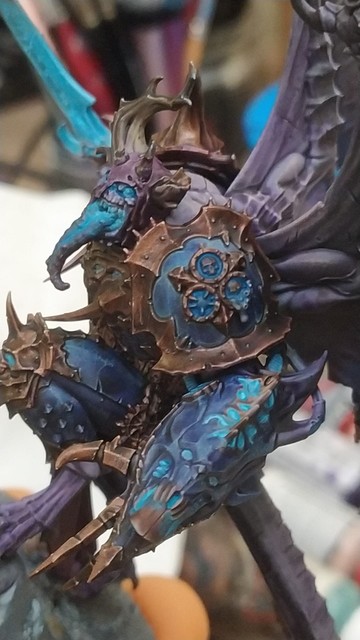 Photo of a warhammer 40k nurgle demon prince painted up in a death knight inspired colour scheme showcasing bronze painted in nmm style but with actual metallic paints