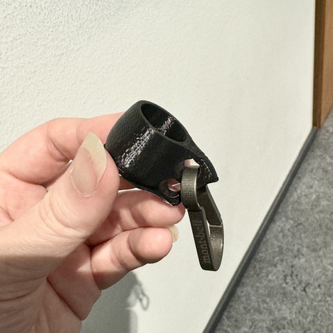 holding the mini kuksa that is looped through a carabiner, the bottom still looks a bit jagged