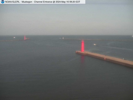 View of Muskegon breakwater in the distance, and the red South Lighthouse defining the entrance of the Muskegon Channel in the foreground. // Image captured at: 2024-05-16 12:20:01 UTC (about 13 min. prior to this post) // Current Temp in Muskegon: 54.41 F | 12.45 C // Precip: broken clouds // Wind: SE at 5.749 mph | 9.25 kph // Humidity: 70%