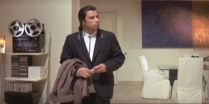 John travolta in pulp fiction, looking around in a bewildered manner.