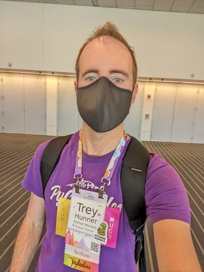 Trey Hunner wearing purple shirt and PyCon badge