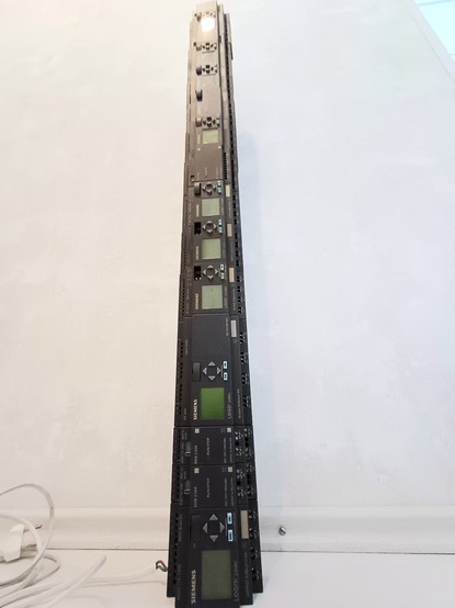 A stacked tower of Siemens LOGO PLCs