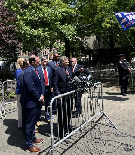 Trump surrogates outside the court in NYC, trying to speak in defence and on behalf of Trump. All dressed like him, blue suit, long red ties.