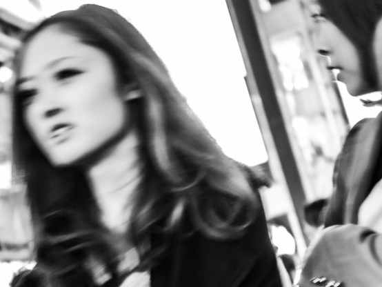 Black and white photograph of women walking in Japan.