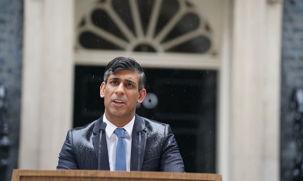 Rishi Sunak calls a general election outside 10 Downing Street. Photograph: Stefan Rousseau/PA

His expensive suit is very wet, hair turned foppish by the rain, truly a miserable spectacle. 