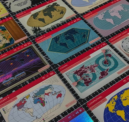 A set of cards from The Projection Collection showing different map projections such as Eckert II, Cassini, and Loximuthal.