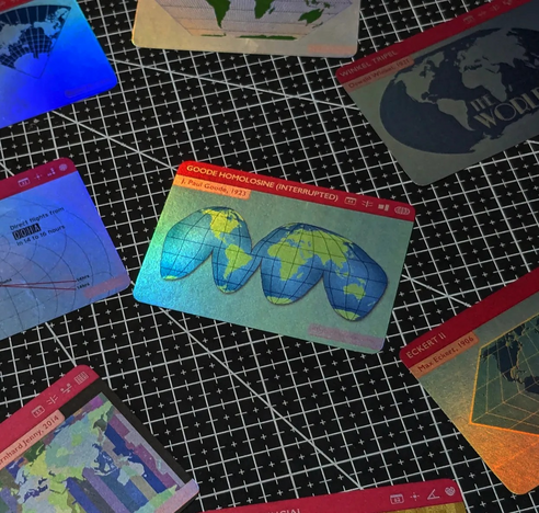 A set of holofoil cards from The Projection Collection showing different map projections.