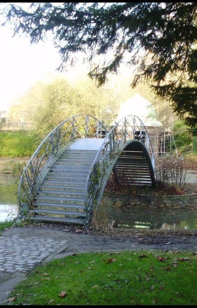 Small bridge over pond in a park in Leuven.