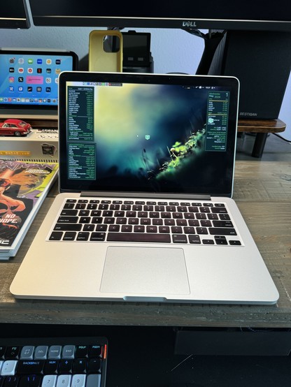 A 2014 MacBook Pro running Mabox Linux.