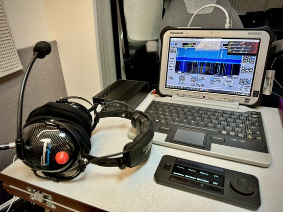 A RadioSport Headet, a ToughPad/Toughbook FZ-G1, a Hermes Lite 2 SDR and a XenceLabs Quick Keys, in a Motorhome 